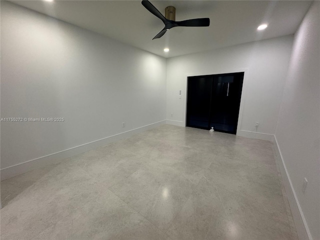 empty room with recessed lighting, ceiling fan, and baseboards