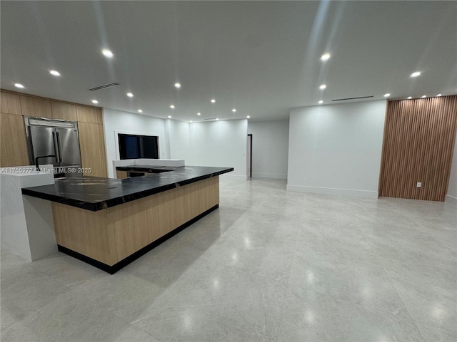 kitchen with recessed lighting, visible vents, modern cabinets, and stainless steel built in refrigerator