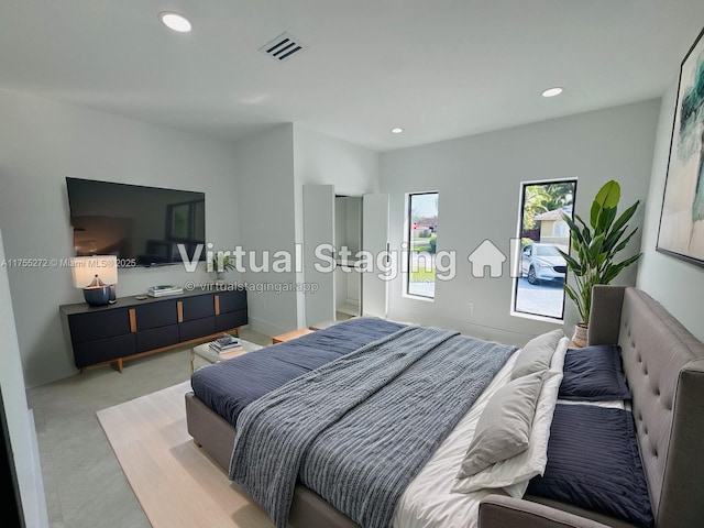 bedroom featuring visible vents, recessed lighting, and light colored carpet