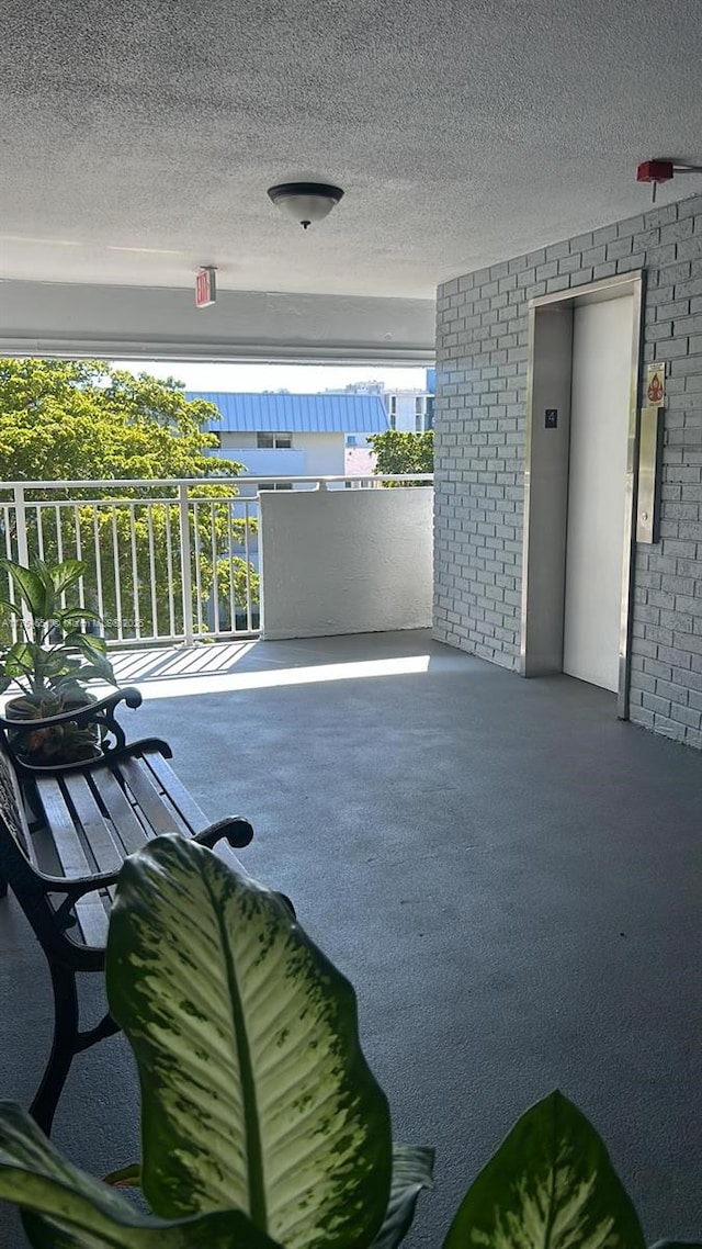 view of patio / terrace featuring elevator