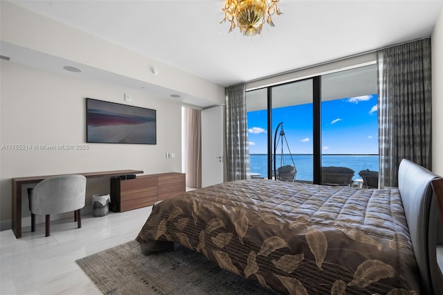 bedroom with access to exterior, floor to ceiling windows, visible vents, and an inviting chandelier