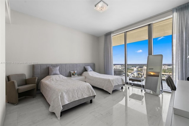 bedroom with access to outside and expansive windows