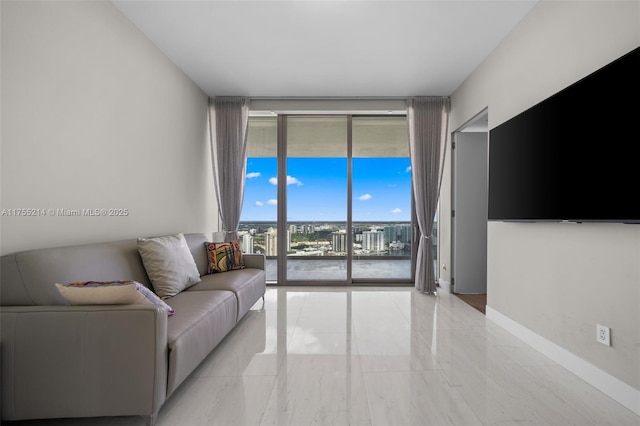 living area featuring baseboards