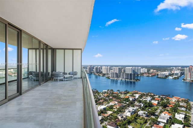 balcony featuring a water view