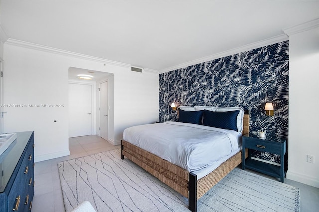 bedroom with ornamental molding, visible vents, baseboards, and wallpapered walls