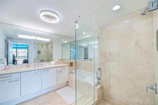 full bath with a stall shower, vanity, ensuite bath, tile patterned flooring, and a bath