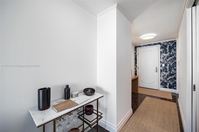 hallway featuring wallpapered walls and baseboards