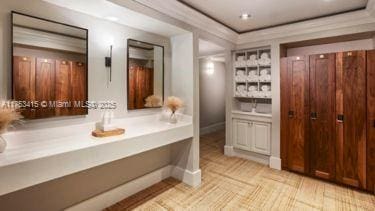 bathroom with vanity and crown molding