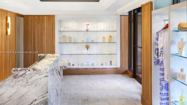 bathroom featuring built in shelves and ornamental molding