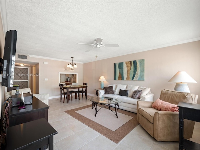 living room with a textured ceiling, light tile patterned floors, ceiling fan with notable chandelier, visible vents, and ornamental molding