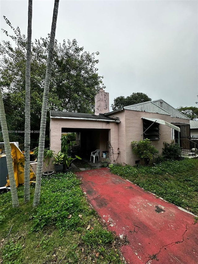 exterior space featuring a chimney