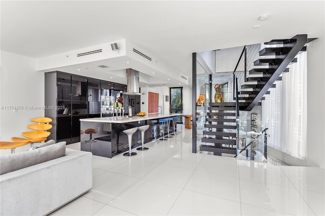 interior space with stairway, recessed lighting, and tile patterned floors