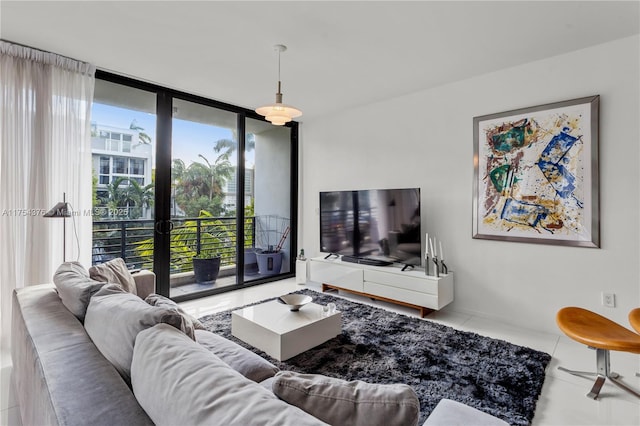 living room with floor to ceiling windows and tile patterned floors