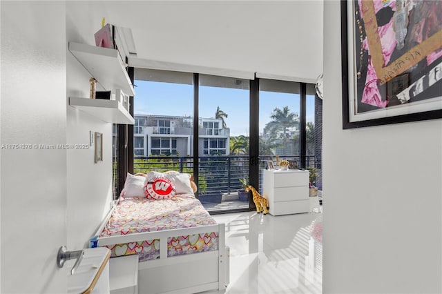 bedroom featuring expansive windows