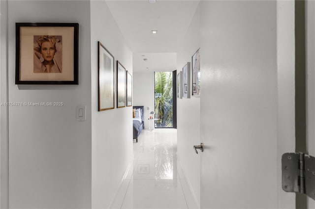 corridor with light tile patterned floors