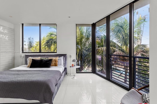 tiled bedroom featuring expansive windows