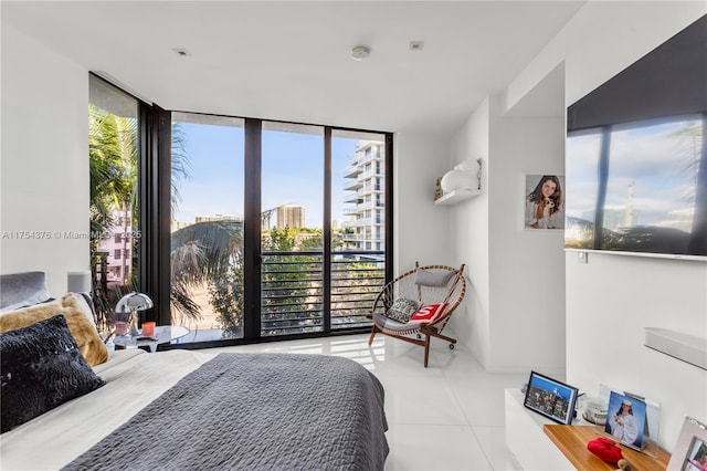 bedroom featuring expansive windows and tile patterned floors