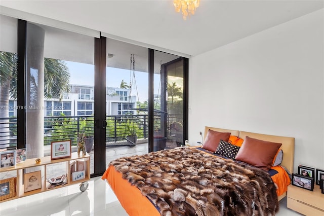 bedroom with expansive windows and access to outside