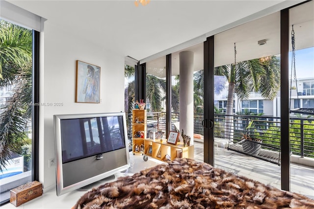 bedroom with expansive windows and multiple windows