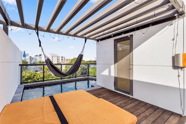 balcony featuring a city view and a pergola