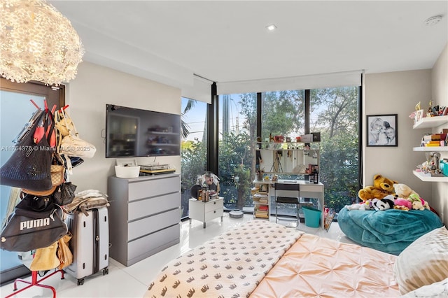 bedroom with expansive windows and an inviting chandelier