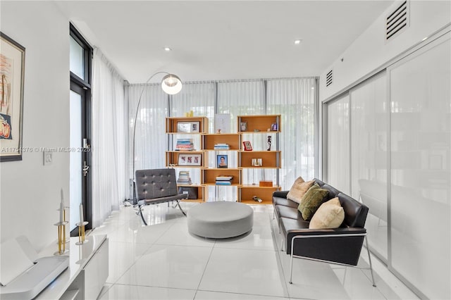 living area featuring visible vents and tile patterned floors