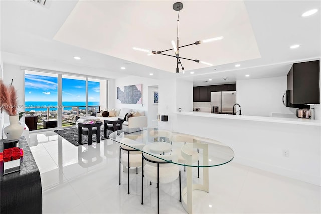 dining area featuring light tile patterned floors, an inviting chandelier, and recessed lighting