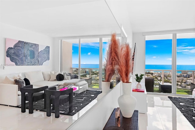 tiled living area with floor to ceiling windows and a water view