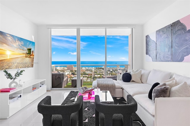 tiled living room with a water view and a wall of windows