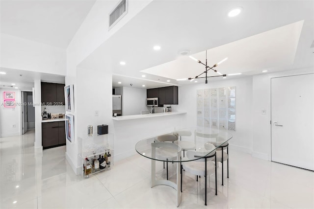 dining space featuring recessed lighting, visible vents, light tile patterned flooring, a chandelier, and baseboards