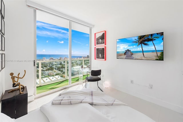 sitting room with floor to ceiling windows