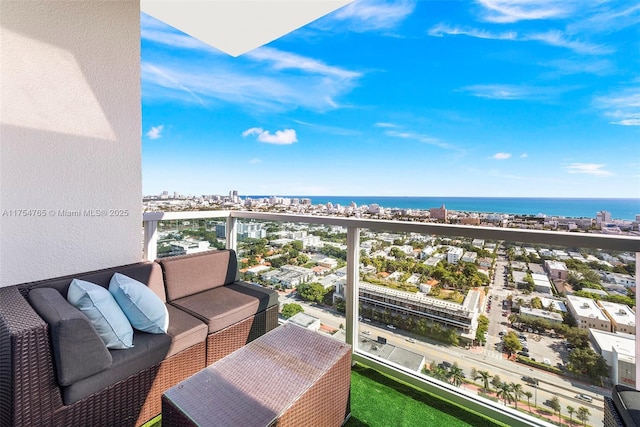 balcony with a water view and a city view