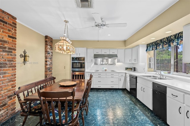 kitchen with light countertops, visible vents, a sink, brick wall, and black appliances