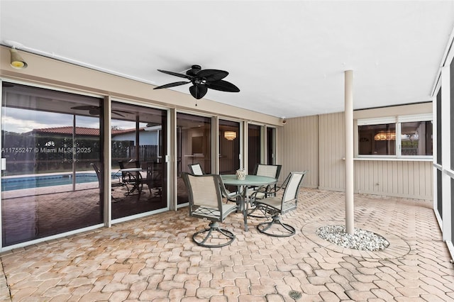 view of patio / terrace featuring outdoor dining space and a ceiling fan