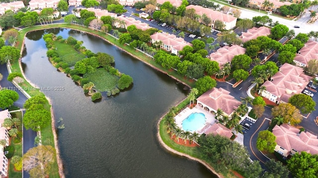 birds eye view of property featuring a water view and a residential view