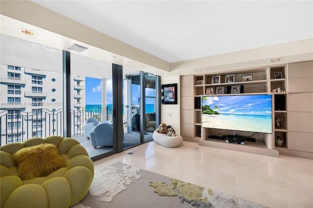 living area featuring a wall of windows, visible vents, and tile patterned floors