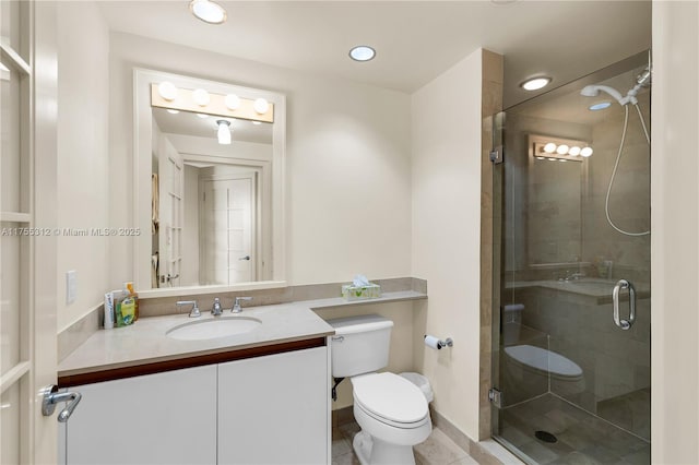 full bath with toilet, tile patterned floors, a shower stall, and vanity