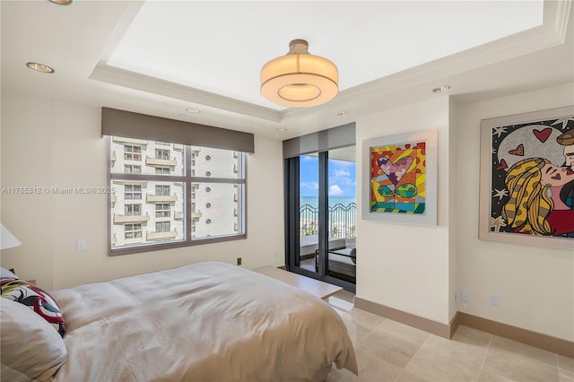 bedroom featuring access to exterior, baseboards, a raised ceiling, and light tile patterned flooring