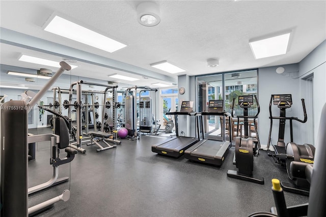 exercise room featuring a textured ceiling