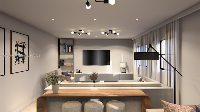 living area featuring baseboards