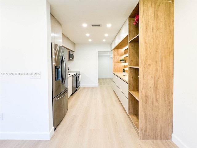kitchen featuring open shelves, stainless steel appliances, light countertops, visible vents, and modern cabinets