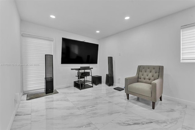 sitting room with recessed lighting, marble finish floor, and baseboards