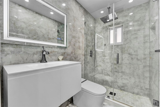 full bath featuring toilet, marble finish floor, a shower stall, and tile walls