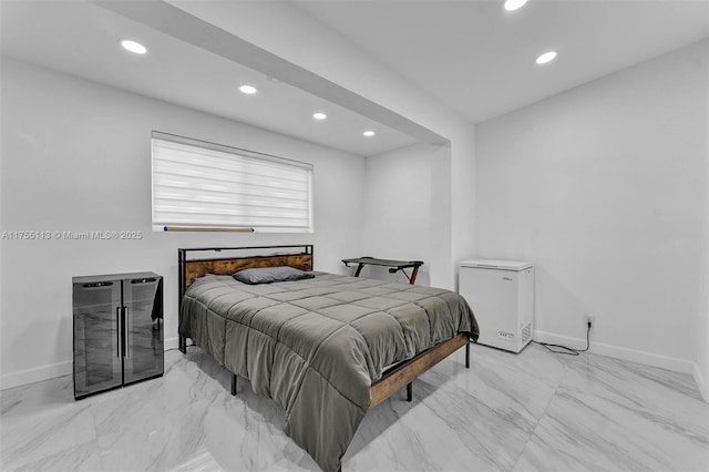 bedroom featuring recessed lighting, baseboards, and fridge