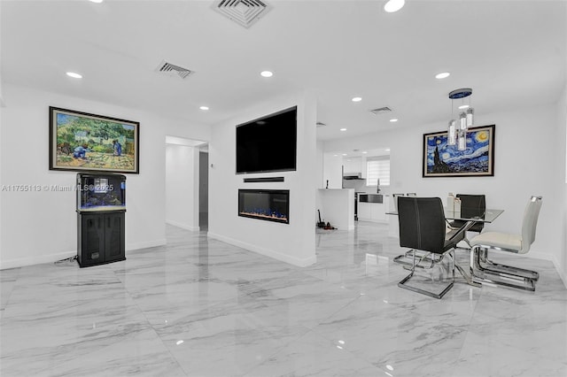 interior space with marble finish floor, visible vents, and recessed lighting