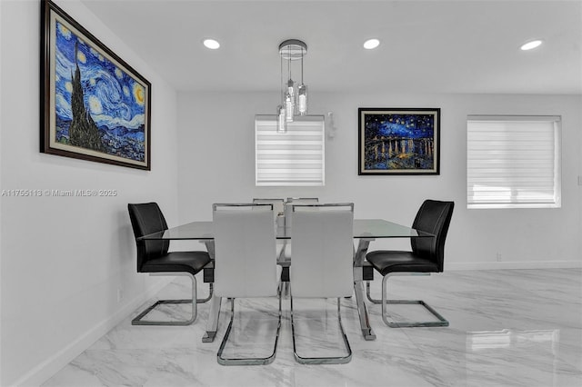 dining area with recessed lighting, marble finish floor, and baseboards