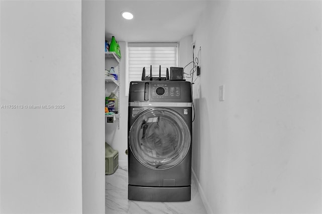 washroom featuring washer / dryer, laundry area, marble finish floor, and baseboards