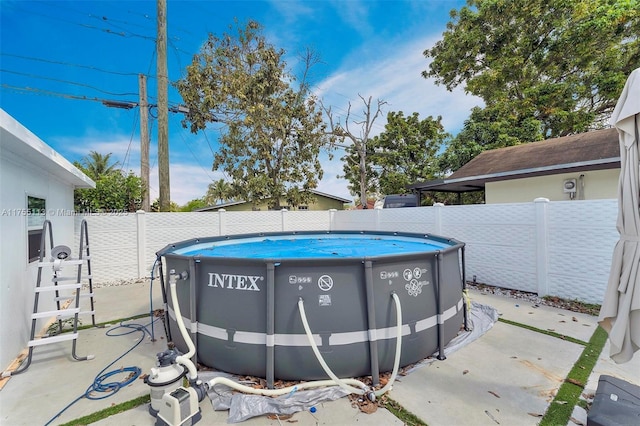 view of swimming pool featuring a fenced backyard and a fenced in pool