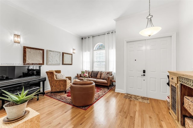 entrance foyer with light wood-style floors and baseboards