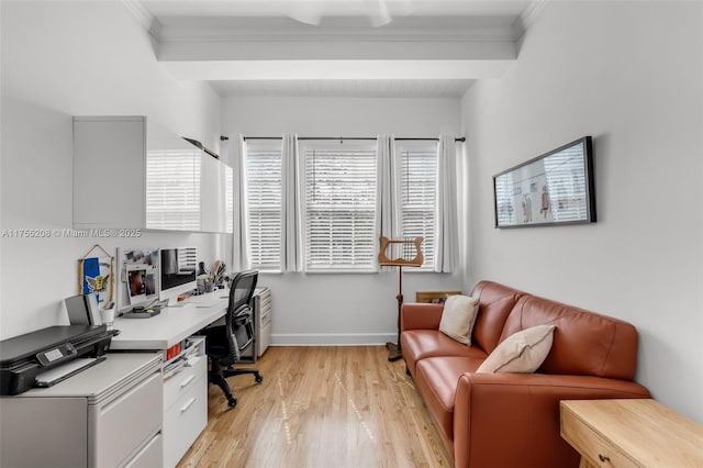 office area with ornamental molding, baseboards, and light wood finished floors